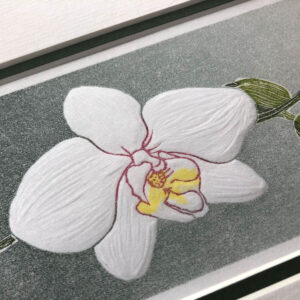 handmade linocut print of a single white orchid bloom with buds against a graded grey background.