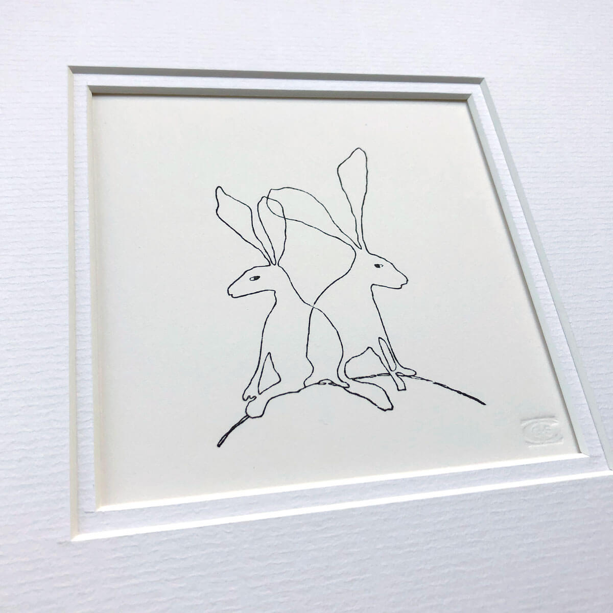handmade woodblock print of hares